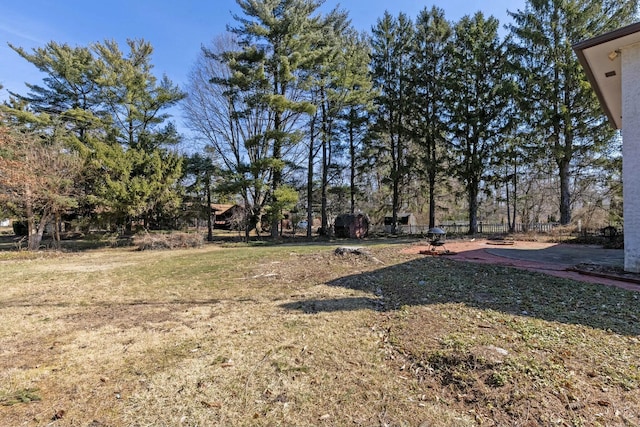 view of yard with a patio and fence