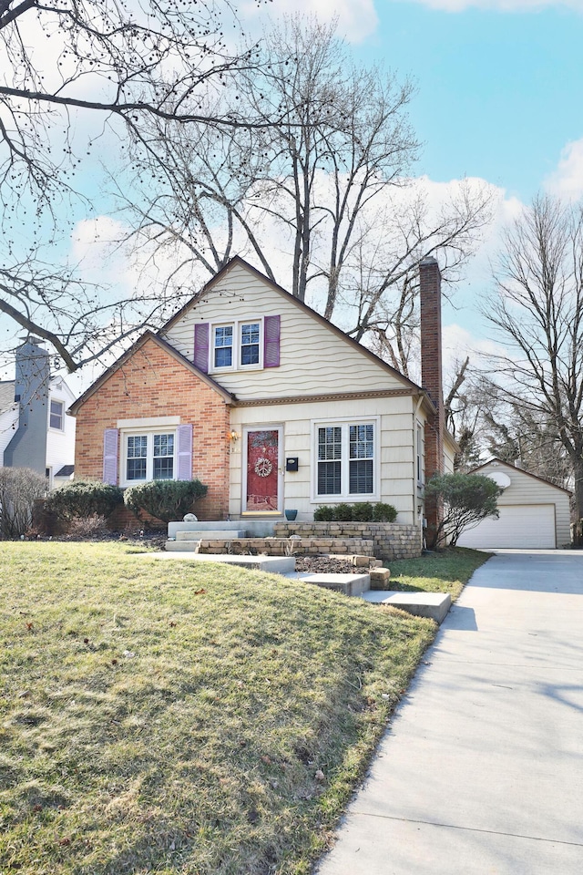 bungalow-style home featuring a garage, a chimney, an outdoor structure, and a front lawn