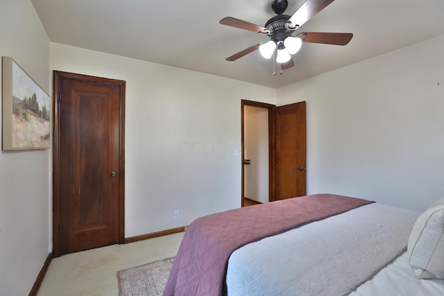 bedroom with baseboards, light carpet, and ceiling fan