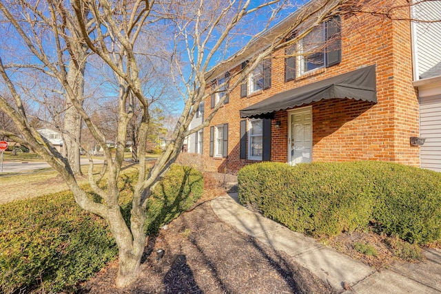 view of front of home with brick siding