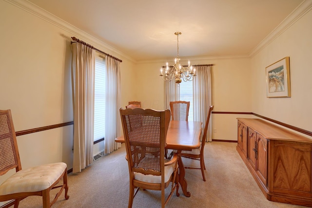 dining area featuring light colored carpet, baseboards, an inviting chandelier, and ornamental molding