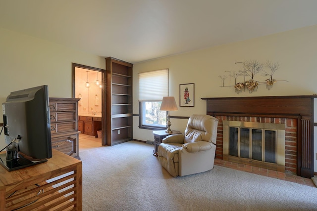 sitting room with a fireplace and carpet