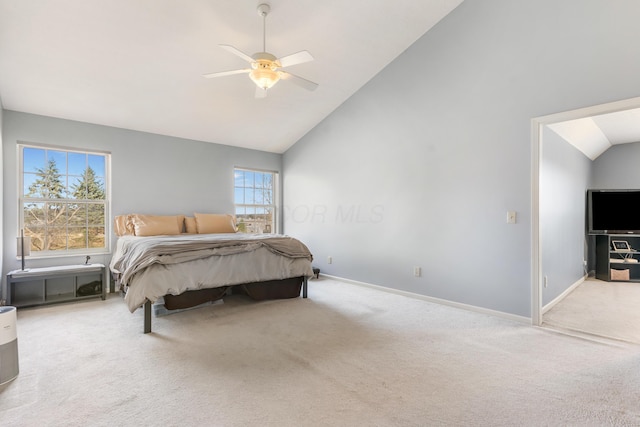 carpeted bedroom featuring baseboards, high vaulted ceiling, and a ceiling fan