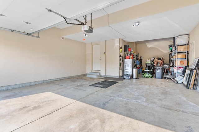 garage featuring baseboards and a garage door opener