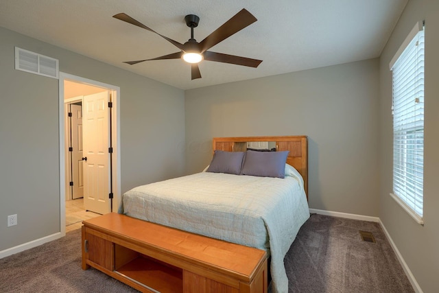 bedroom with a ceiling fan, baseboards, visible vents, and carpet floors