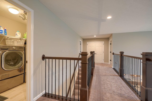 hall featuring recessed lighting, an upstairs landing, baseboards, and carpet floors