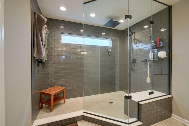 full bathroom featuring recessed lighting, a shower stall, and baseboards