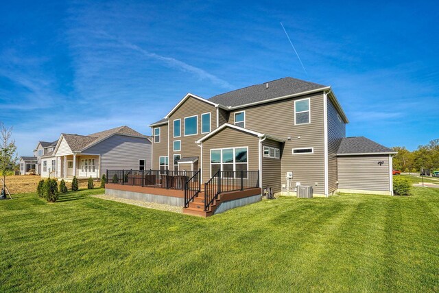 5511 Timber Heights Ln, Grove City, OH 43123 - rear view of house featuring a lawn, a shingled roof, central air condition unit, and a wooden deck