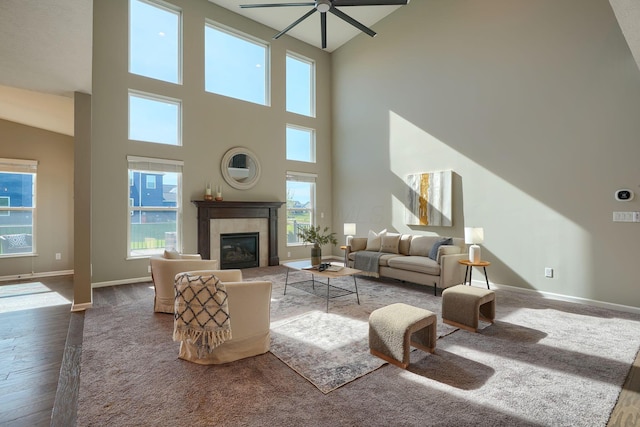 5511 Timber Heights Ln, Grove City, OH 43123 - living area featuring baseboards, ceiling fan, a high ceiling, and a wealth of natural light