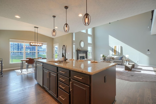 5511 Timber Heights Ln, Grove City, OH 43123 - kitchen with dark wood-type flooring, a sink, lofted ceiling, and dishwasher