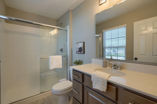 5511 Timber Heights Ln, Grove City, OH 43123 - bathroom with vanity, a stall shower, and toilet