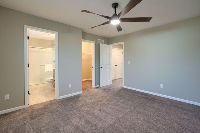 5511 Timber Heights Ln, Grove City, OH 43123 - unfurnished bedroom featuring a walk in closet, visible vents, baseboards, carpet floors, and connected bathroom
