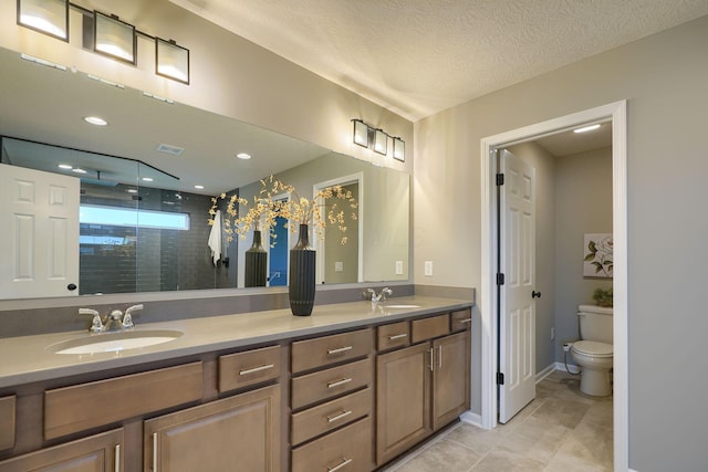 5511 Timber Heights Ln, Grove City, OH 43123 - full bathroom featuring double vanity, toilet, recessed lighting, a sink, and a stall shower