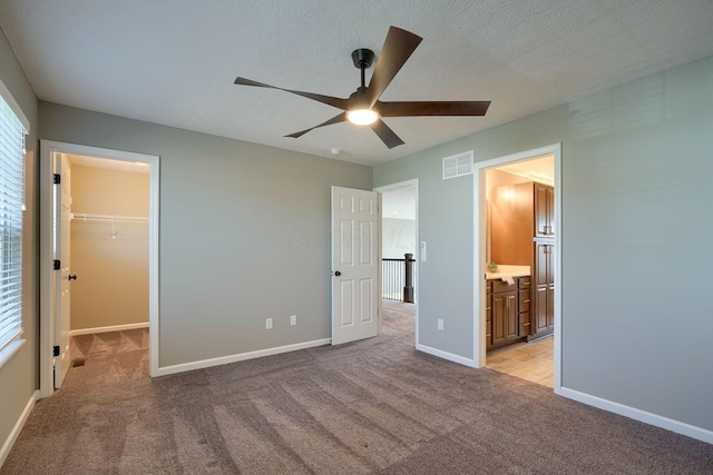 5511 Timber Heights Ln, Grove City, OH 43123 - unfurnished bedroom featuring visible vents, baseboards, carpet floors, and a spacious closet