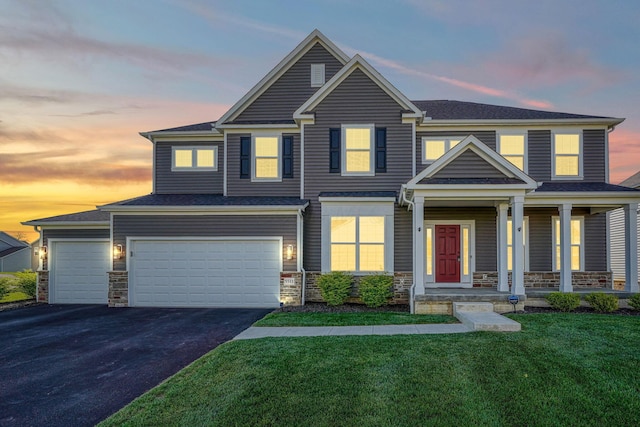 5511 Timber Heights Ln, Grove City, OH 43123 - craftsman-style home with a garage, aphalt driveway, a front yard, and stone siding