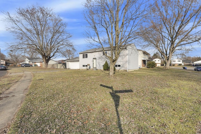 view of front of home featuring a residential view and a front lawn