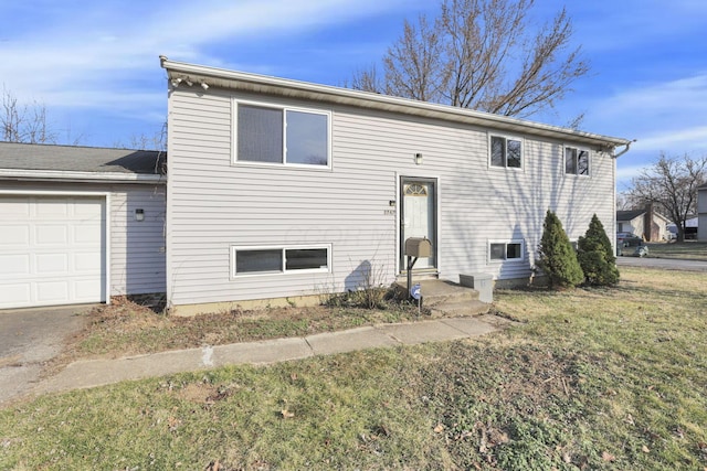 view of front of home with a garage and a front yard