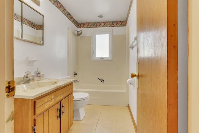 bathroom featuring vanity, shower / tub combination, and toilet