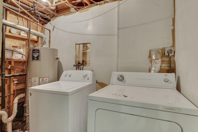 laundry room featuring independent washer and dryer, laundry area, and water heater