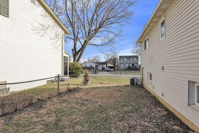 view of yard with cooling unit and fence