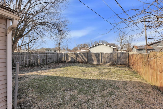 view of yard with a fenced backyard