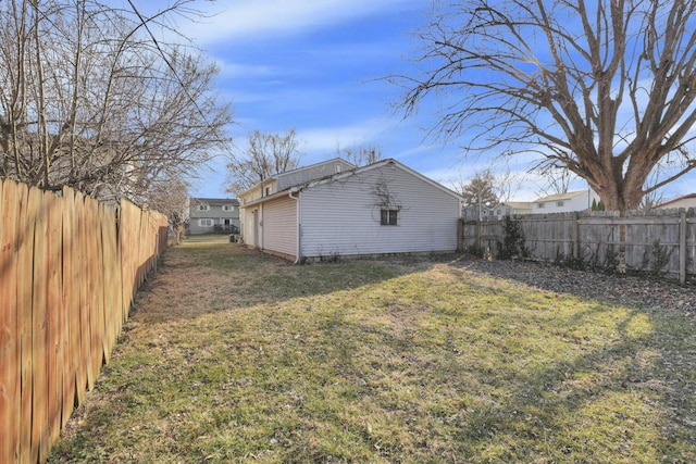 view of yard with a fenced backyard