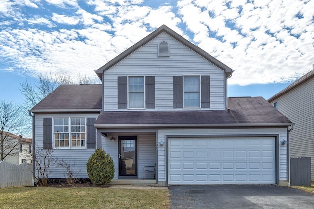 view of front of home with fence, a garage, driveway, and a shingled roof