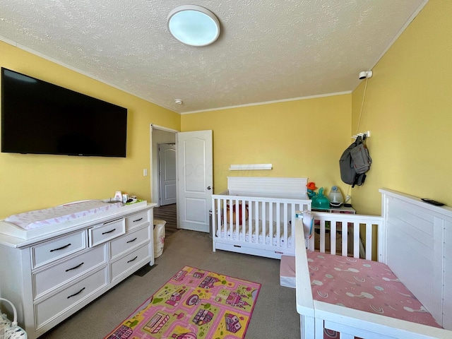 carpeted bedroom with a textured ceiling