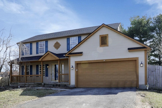 view of front of home featuring aphalt driveway, a garage, a porch, and fence