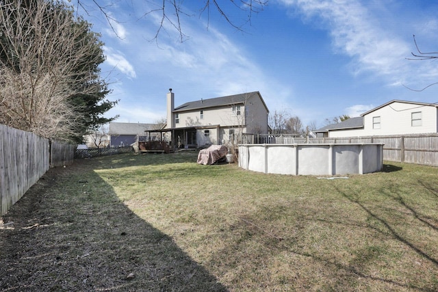 view of yard featuring a fenced in pool and a fenced backyard