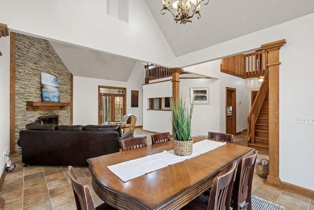 dining room featuring stairway, high vaulted ceiling, and an inviting chandelier