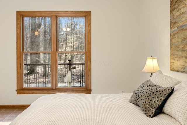 tiled bedroom with baseboards