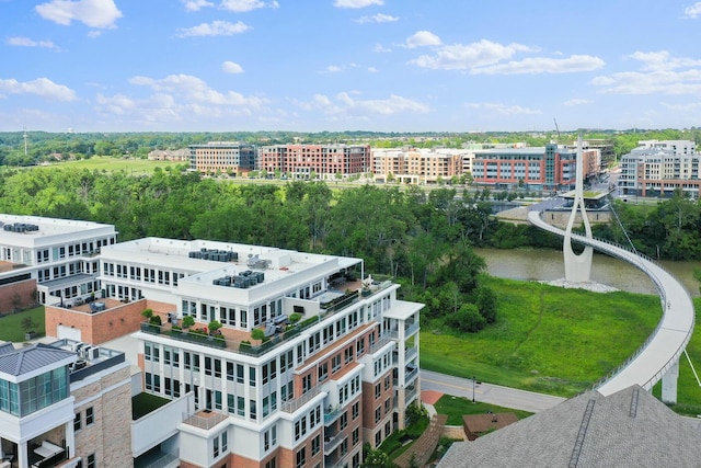 birds eye view of property with a city view and a water view