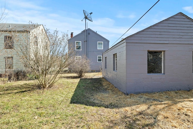 view of property exterior featuring a yard