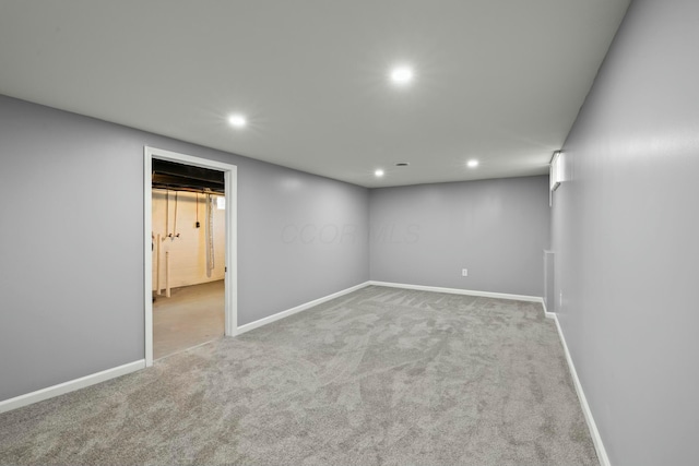 finished basement featuring carpet flooring, recessed lighting, and baseboards