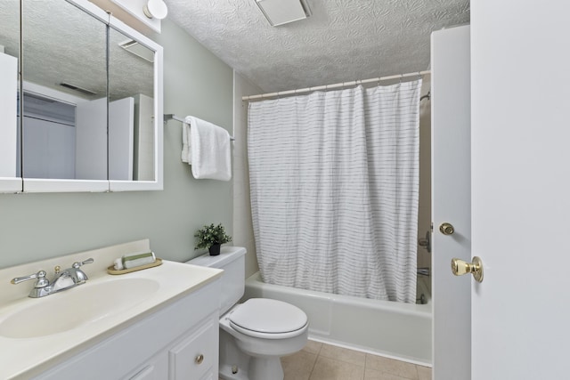 full bathroom featuring shower / bath combo with shower curtain, vanity, tile patterned floors, and a textured ceiling