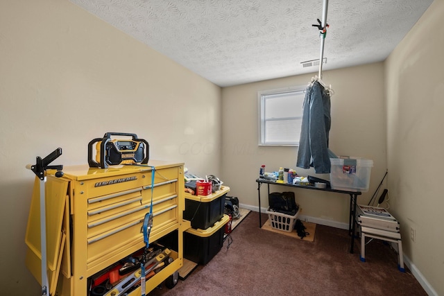 misc room featuring visible vents, baseboards, carpet floors, and a textured ceiling