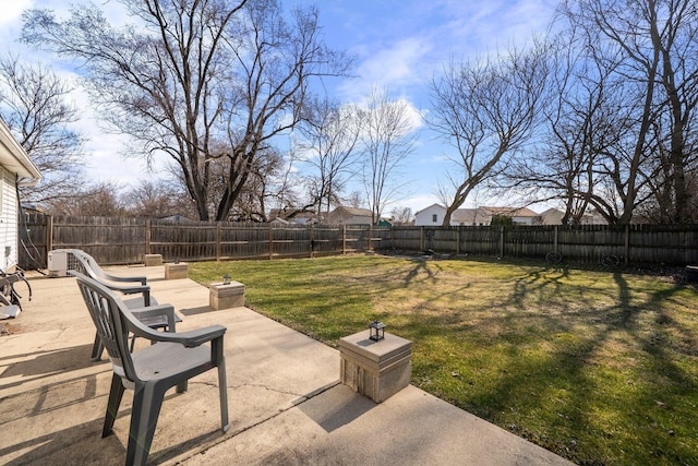 view of yard with a patio and a fenced backyard