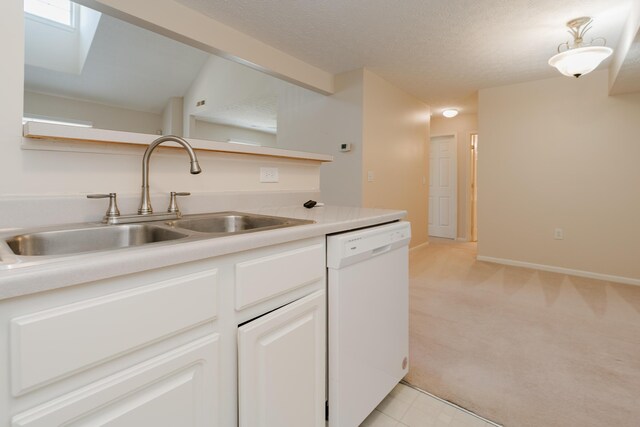 kitchen featuring white cabinetry, a sink, light countertops, a textured ceiling, and dishwasher