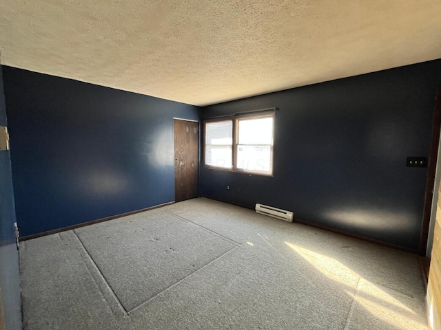 380 W Neff St, Morral, OH 43337 - spare room with baseboard heating and a textured ceiling