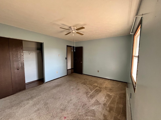380 W Neff St, Morral, OH 43337 - unfurnished bedroom with a closet, carpet floors, baseboards, and a ceiling fan