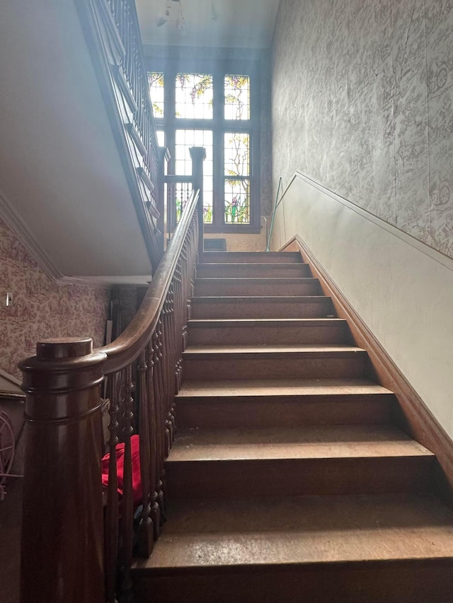 stairs with crown molding