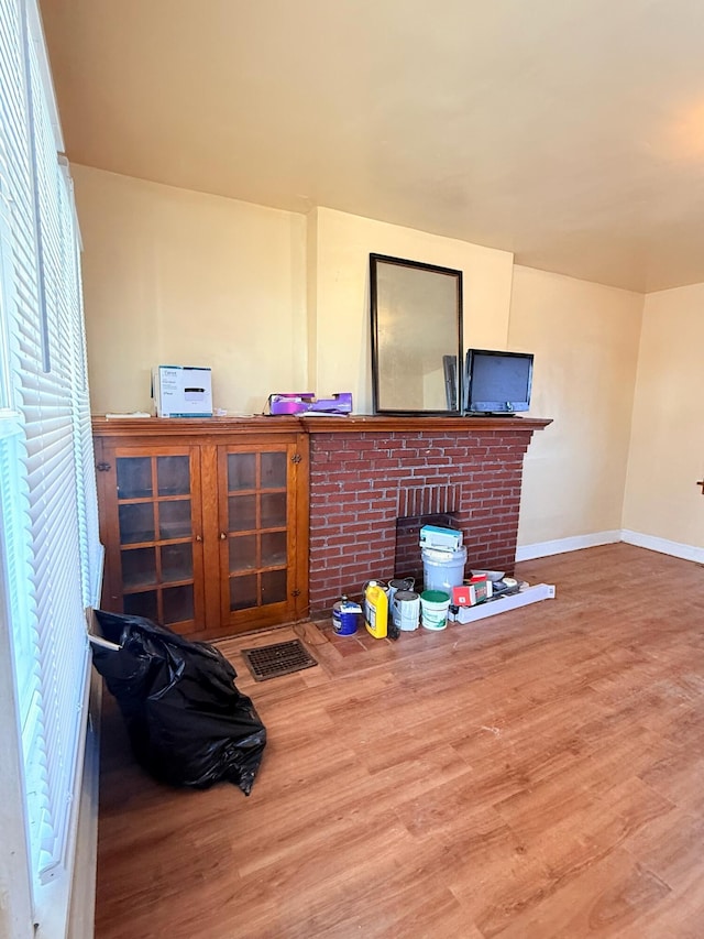 interior space featuring baseboards and wood finished floors