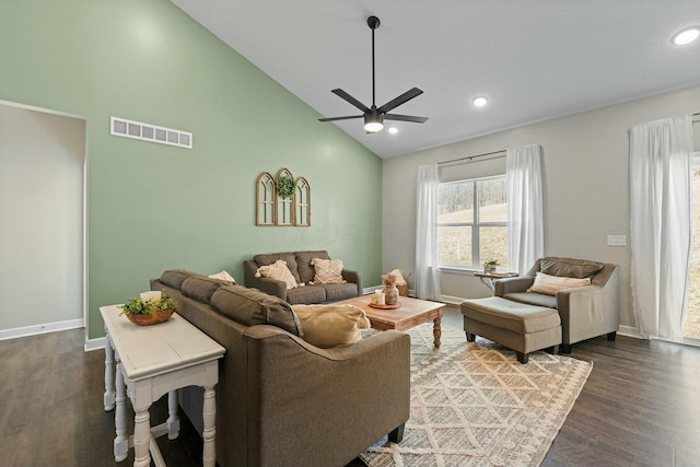 living room featuring visible vents, baseboards, dark wood-style floors, and a ceiling fan