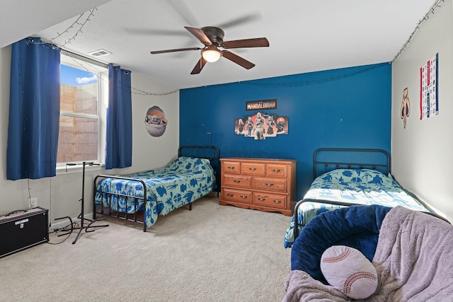 carpeted bedroom featuring visible vents and ceiling fan