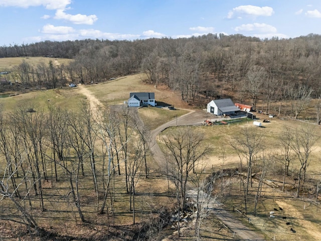 birds eye view of property with a rural view and a forest view