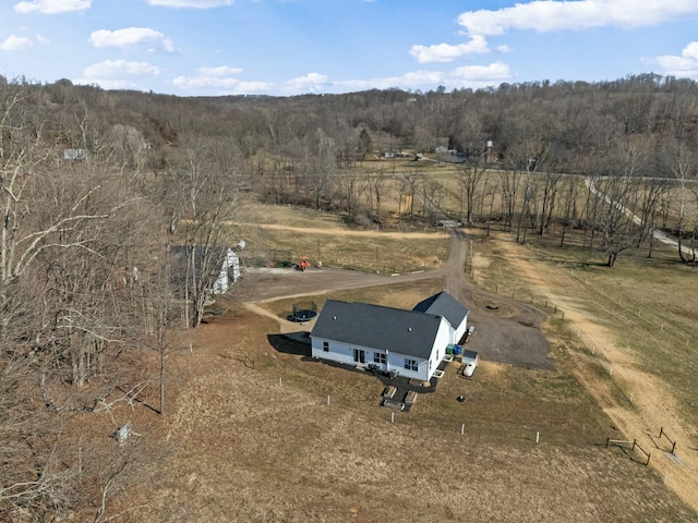 bird's eye view with a rural view and a wooded view