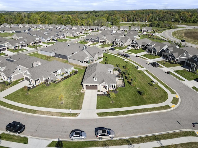 birds eye view of property featuring a forest view and a residential view