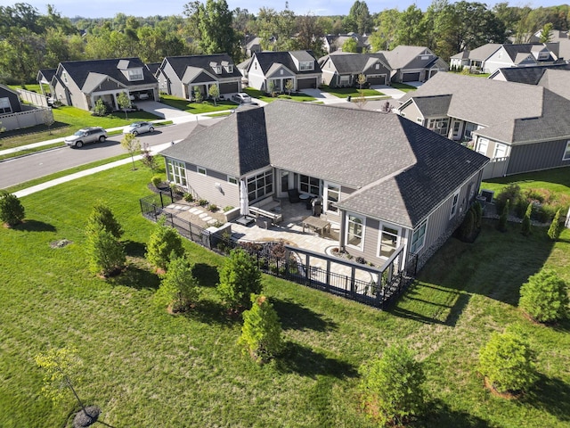 birds eye view of property with a residential view