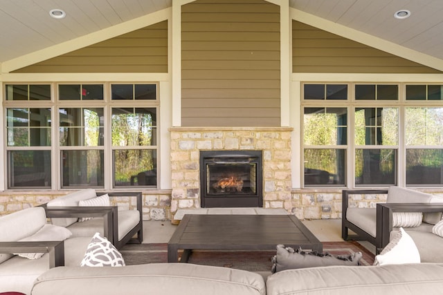 view of patio / terrace with an outdoor living space with a fireplace